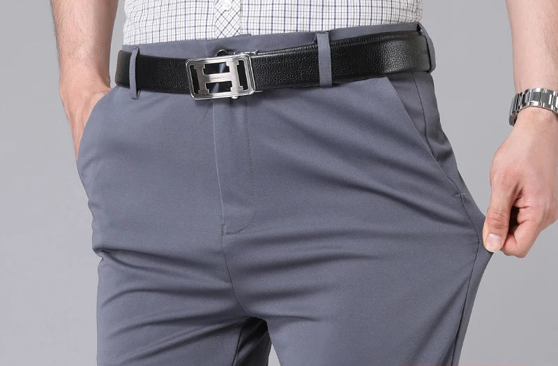 Men's 4-way stretch dress pants, gray, waist and belt detail showing fabric stretch