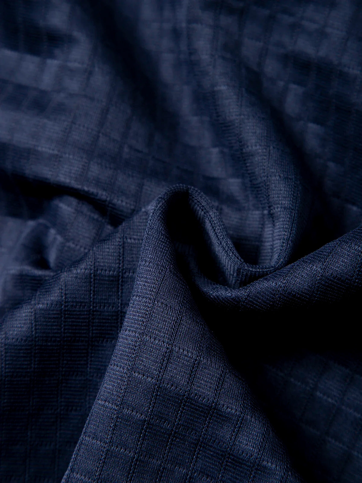 Men's waffle knit pullover hoodie, close-up of waffle-knit fabric texture in navy