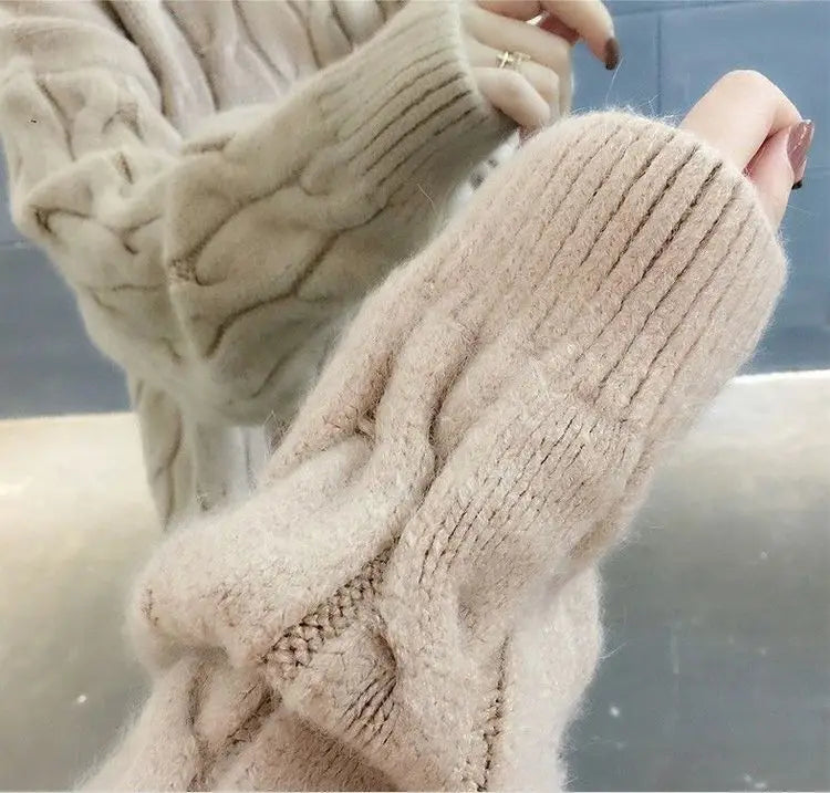Women's light pink twisted cable knit cashmere sweater close-up sleeve detail texture