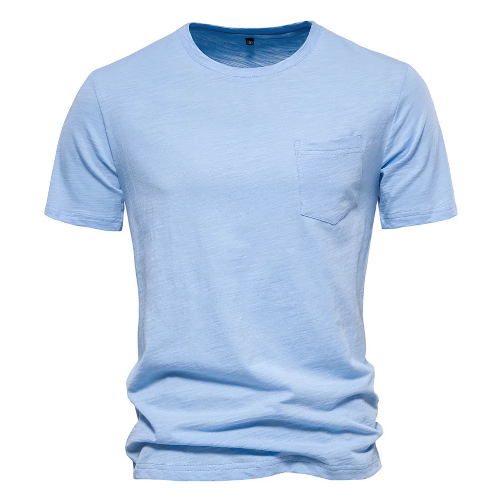 Men's 100% cotton O-neck t-shirt in light blue with chest pocket and short sleeves, front view