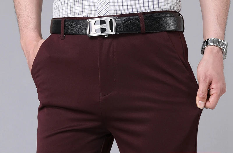 Men's 4-way stretch dress pants, burgundy, waist and belt detail showing fabric stretch