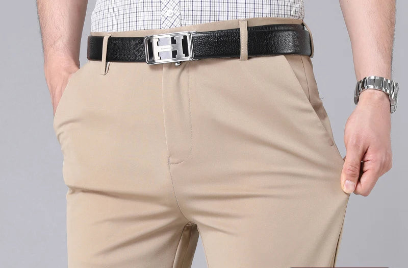Men's 4-way stretch dress pants, khaki, waist and belt detail showing fabric stretch