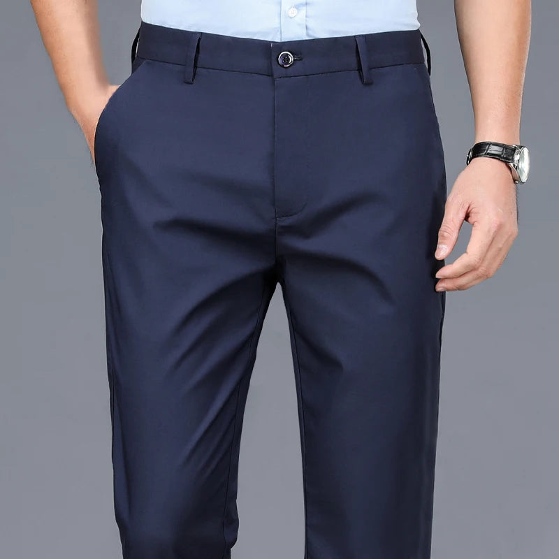 Men's 4-way stretch dress pants, navy blue, front view with waist detail