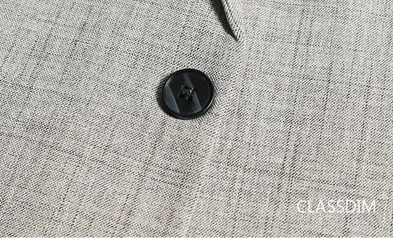 Men's slim fit blazer, beige, single button detail on fabric texture, close-up