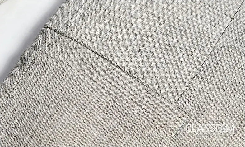 Men's slim fit blazer, beige, pocket stitching detail on fabric texture, close-up