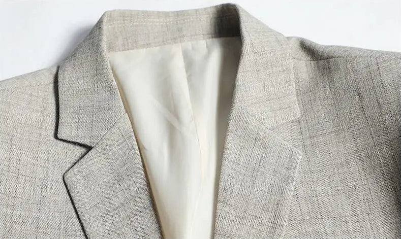 Men's slim fit blazer, light gray, notched lapel and fabric texture detail, close-up