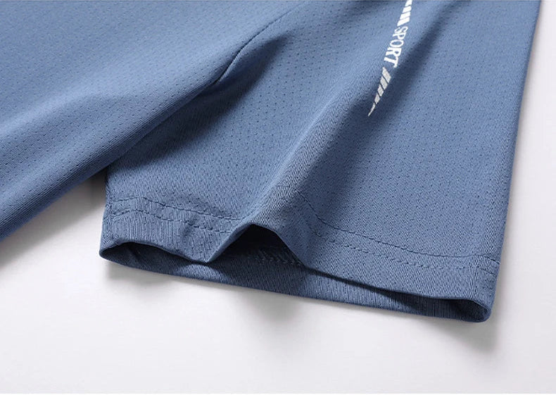 Close-up of athletic t-shirt hem construction and reflective stripe with sport print detail