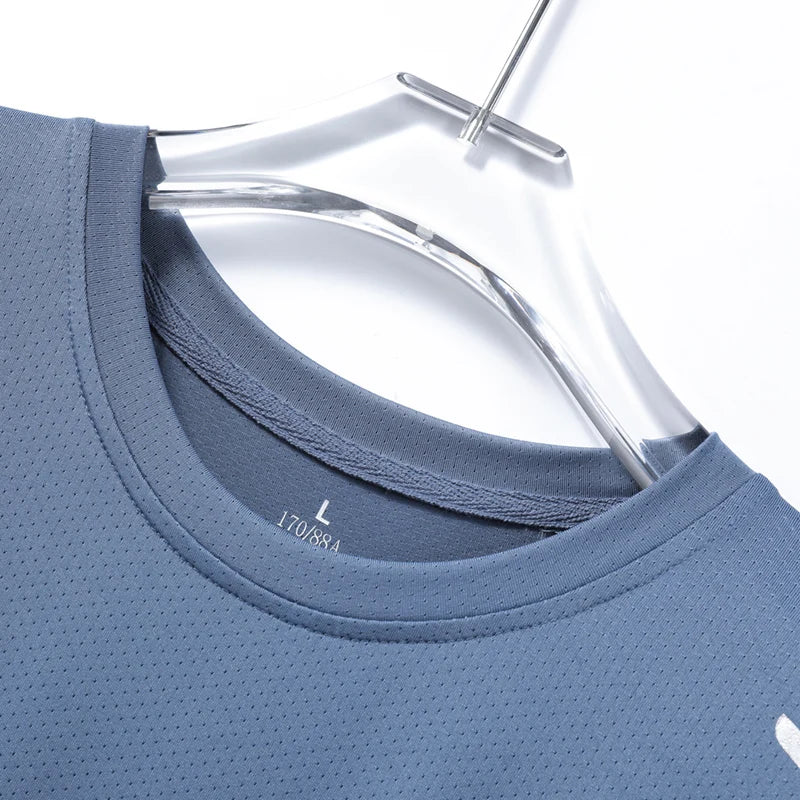 Close-up of slate blue athletic t-shirt neck label and collar construction detail