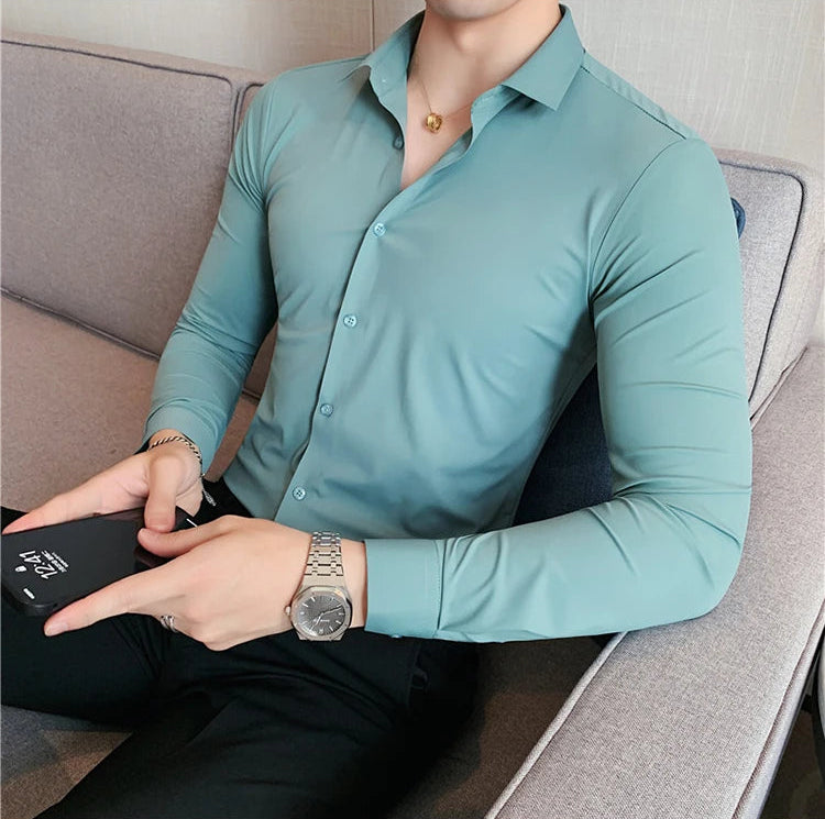 Men's slim fit dress shirt in teal broadcloth long sleeve business shirt - front view sitting relaxed lifestyle