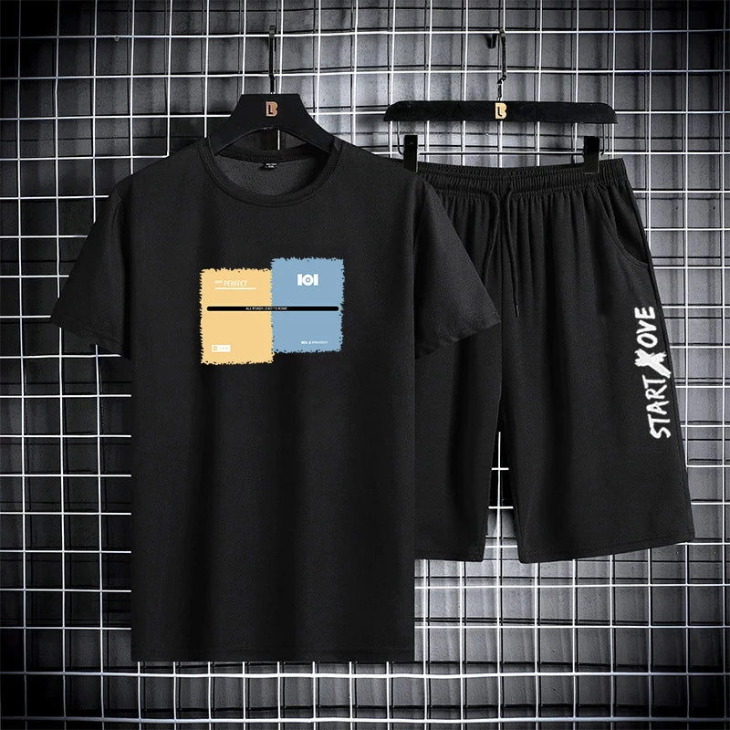 Men's summer 2-piece set in black with color block graphic print - short sleeve t-shirt with matching shorts, front view