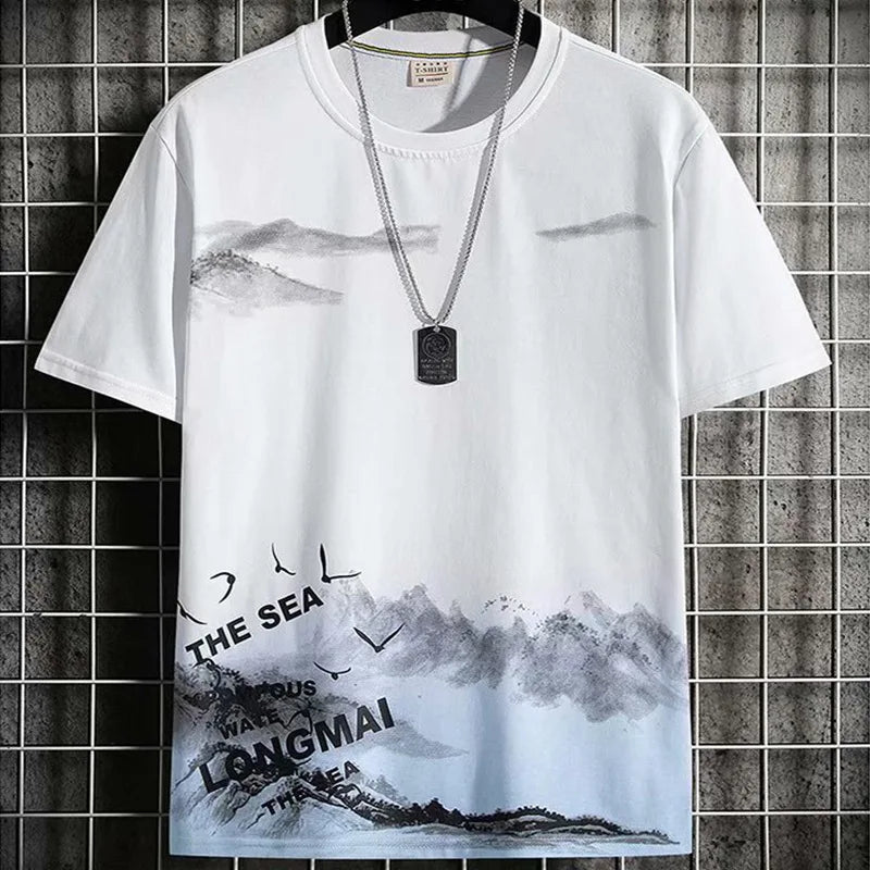 Men's short sleeve graphic t-shirt in white with mountain and ocean print design - part of summer 2-piece set, front view