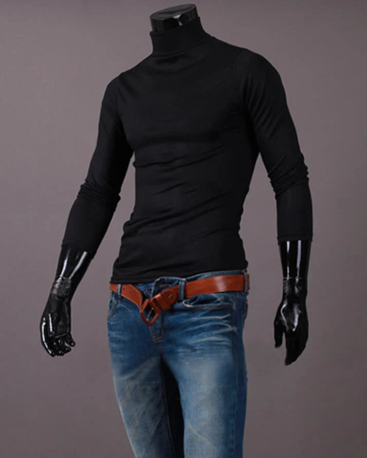 Men's thermal base layer turtleneck long sleeve top, black, styled on mannequin with jeans and belt, front view