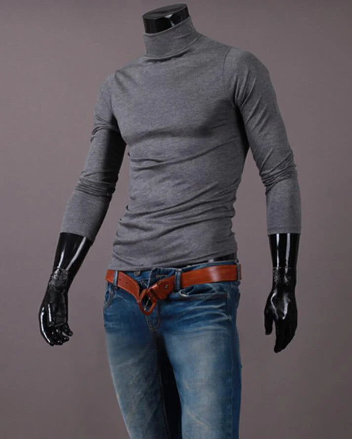 Men's thermal base layer turtleneck long sleeve top, gray, styled on mannequin with jeans and belt, front view