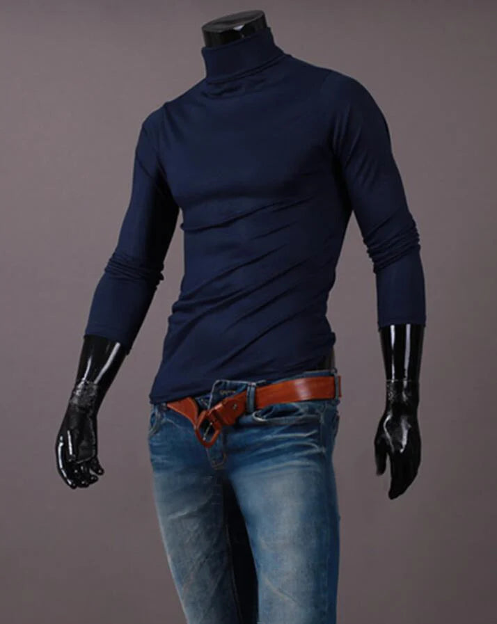 Men's thermal base layer turtleneck long sleeve top, navy blue, styled on mannequin with jeans and belt, front view