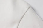 Close-up of white knitted fabric texture on men's turtleneck pullover sweater - soft fleece lined material detail