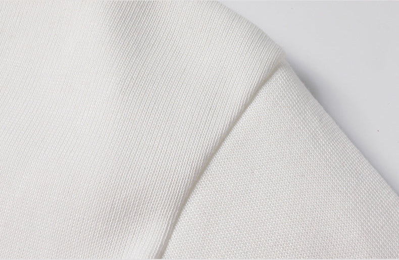 Close-up of white knitted fabric texture on men's turtleneck pullover sweater - soft fleece lined material detail