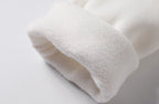 Close-up of soft fleece lining interior on men's white turtleneck pullover sweater - warm inner fabric detail