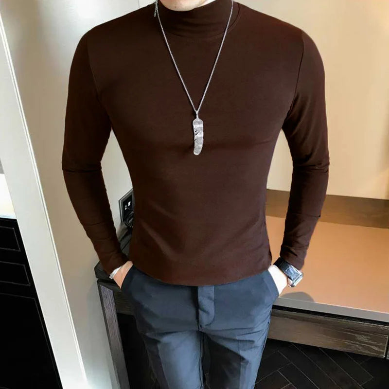 Men's turtleneck long sleeve shirt in dark brown - slim fit high elastic cotton pullover, front three-quarter view styled on model with gray pants