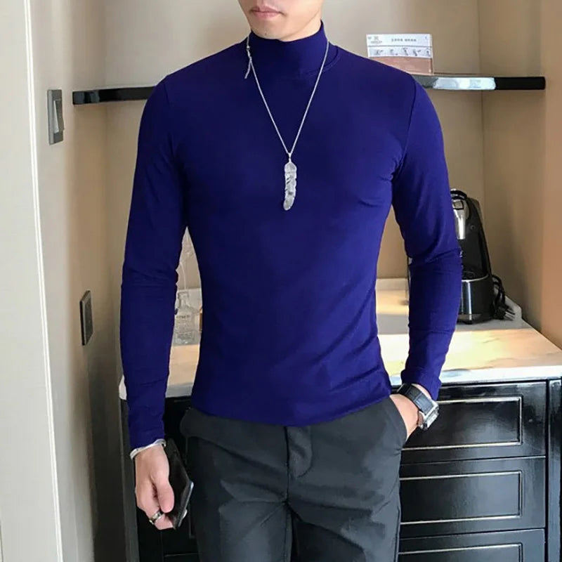 Men's turtleneck long sleeve shirt in navy blue - slim fit high elastic cotton pullover, front three-quarter view styled on model with dark pants