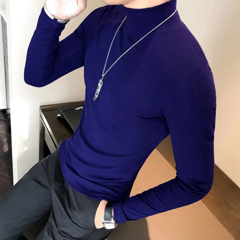 Men's turtleneck long sleeve shirt in navy blue - slim fit high elastic cotton pullover, side view styled on model with dark pants