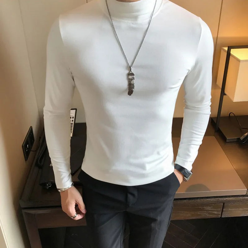 Men's turtleneck long sleeve shirt in white - slim fit high elastic cotton pullover, front three-quarter view styled on model with dark pants