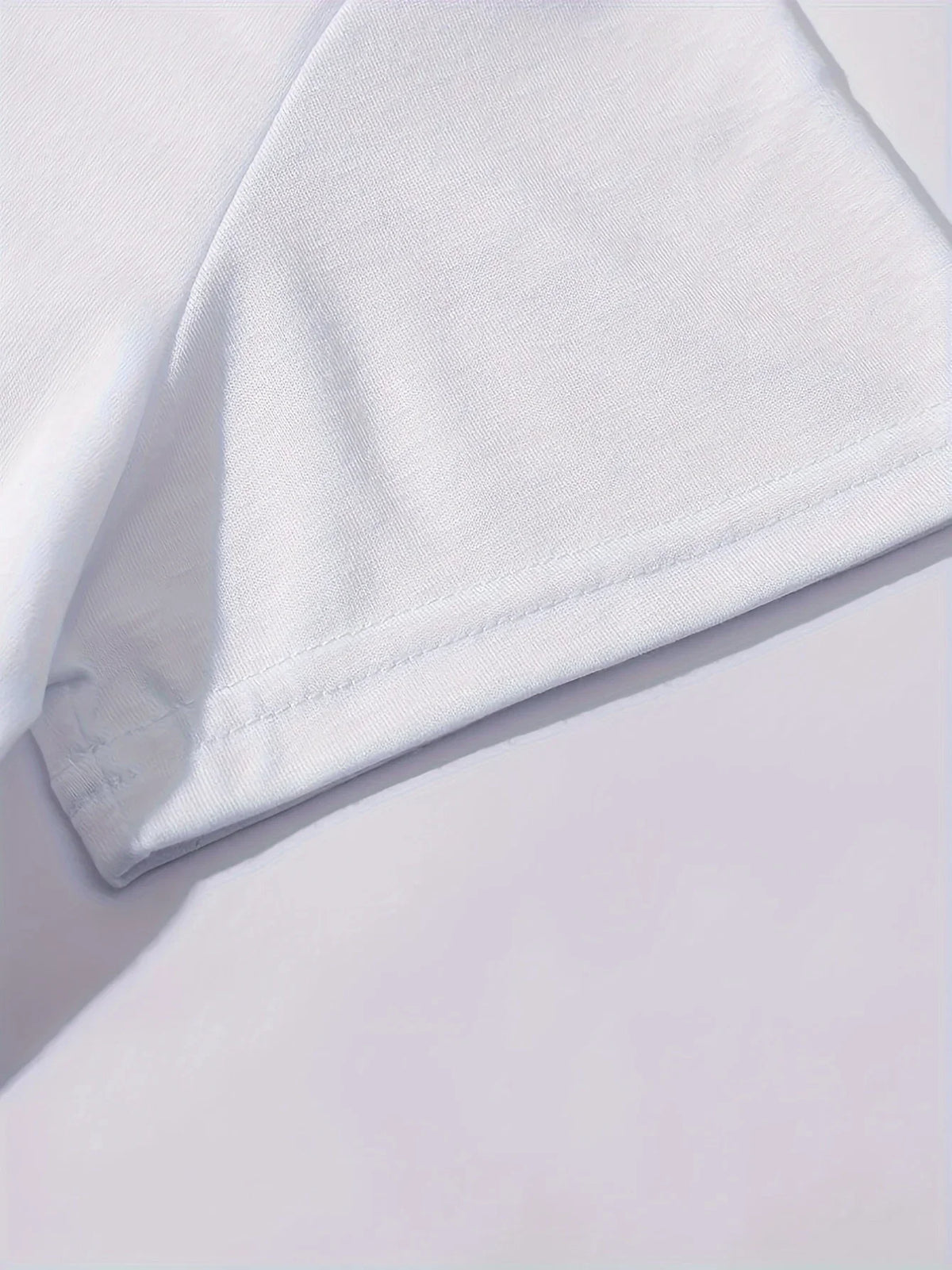 Close-up of white polyester fabric and crew neck detail on women's Paris graphic tee, soft lightweight material