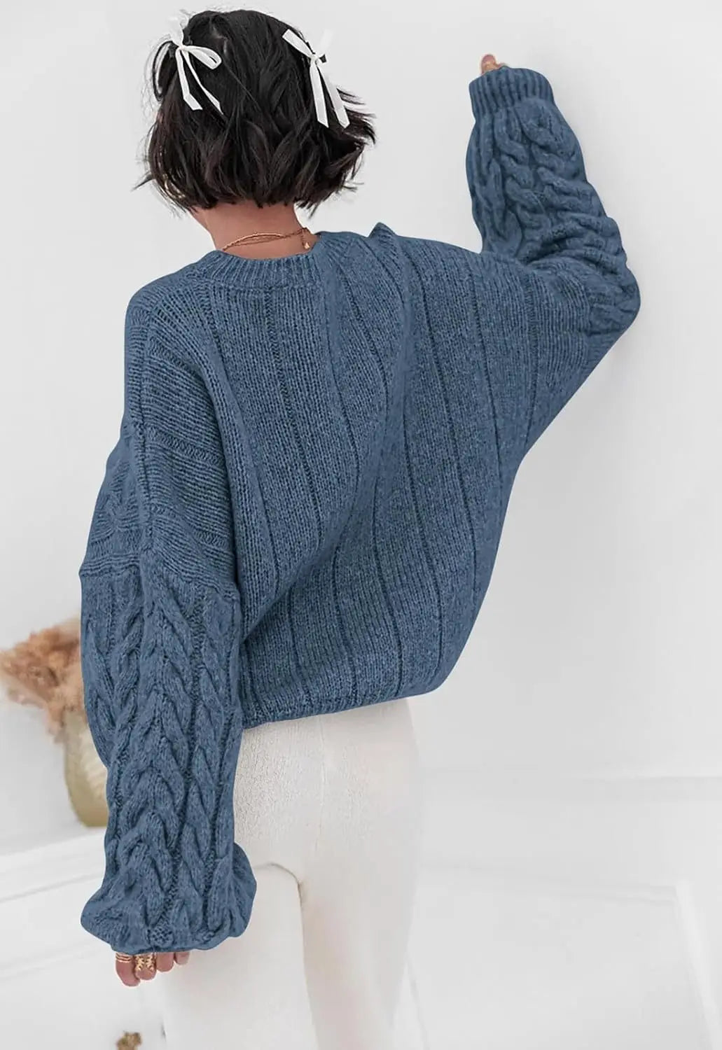 Women's blue O-neck knitted sweater back view cable knit pattern loose fit winter 2025