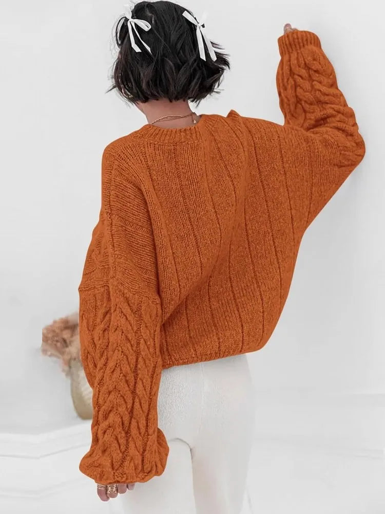 Women's orange O-neck knitted sweater back view cable knit pattern loose fit winter 2025