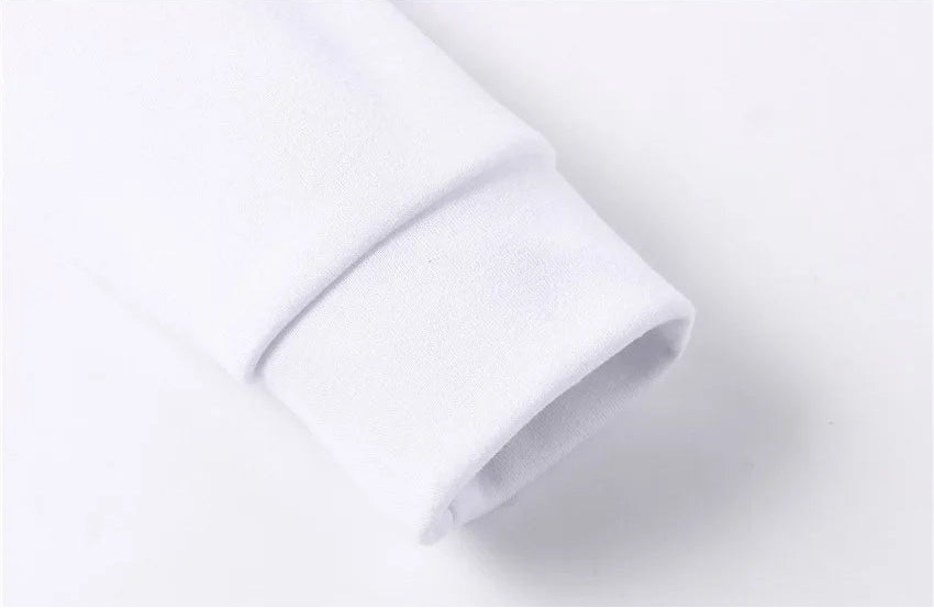Close-up of white Rindu activewear showing hoodie pocket detail and fleece texture