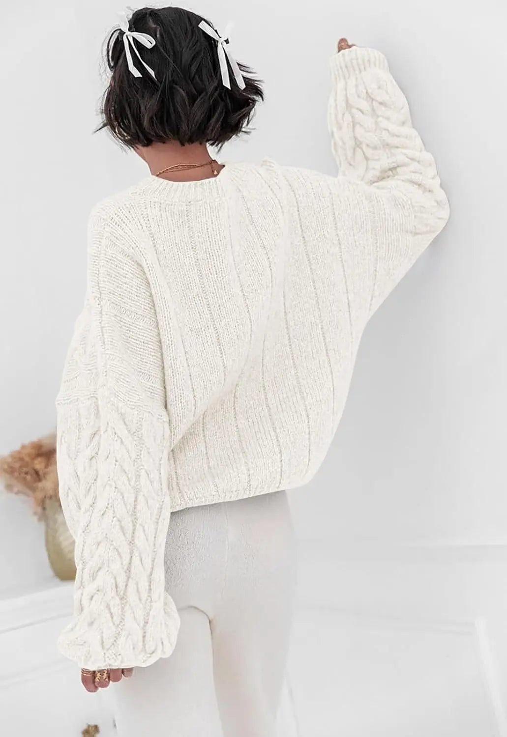Women's white O-neck knitted sweater back view cable knit pattern loose fit winter 2025
