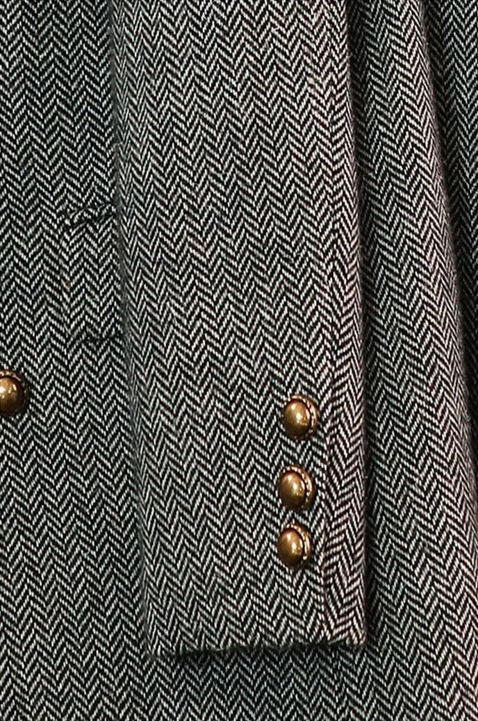 Women's gray elegant blazer jacket herringbone pattern gold buttons close-up detail