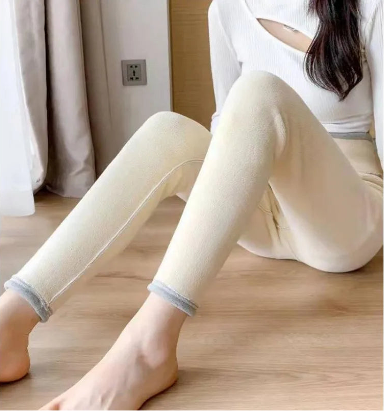 Woman wearing white fleece lined leggings high waist thermal pants - cozy winter loungewear