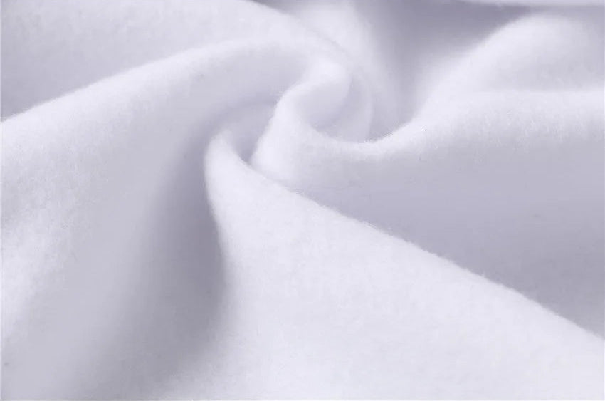 Close-up of white Rindu activewear showing soft fleece fabric folds and texture