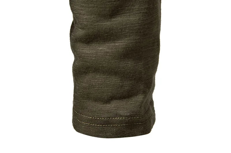 Close-up army green henley t-shirt sleeve hem detail cotton fabric texture