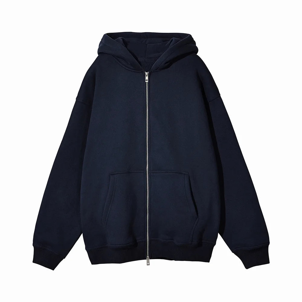 Close-up of navy blue Rindu zip-up hoodie showing front zipper and pockets
