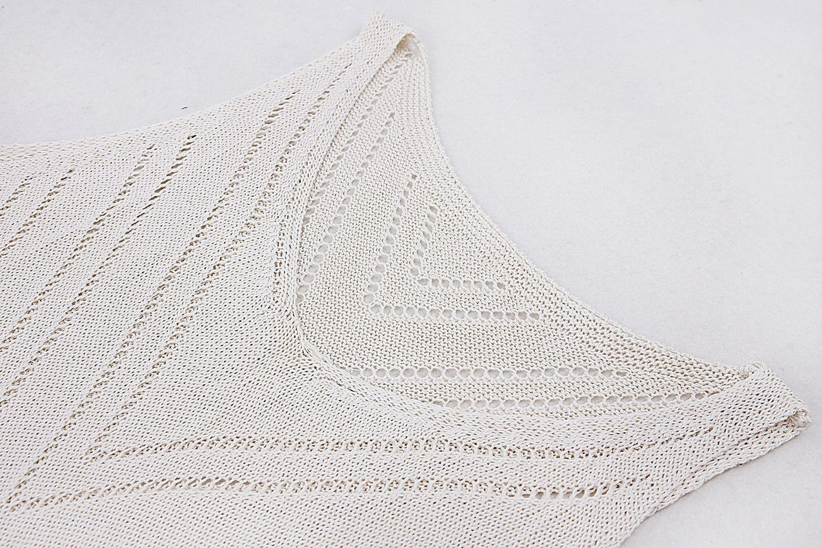 Close-up of V-neck detail and open-knit fabric texture with diagonal pattern on the women's backless maxi dress