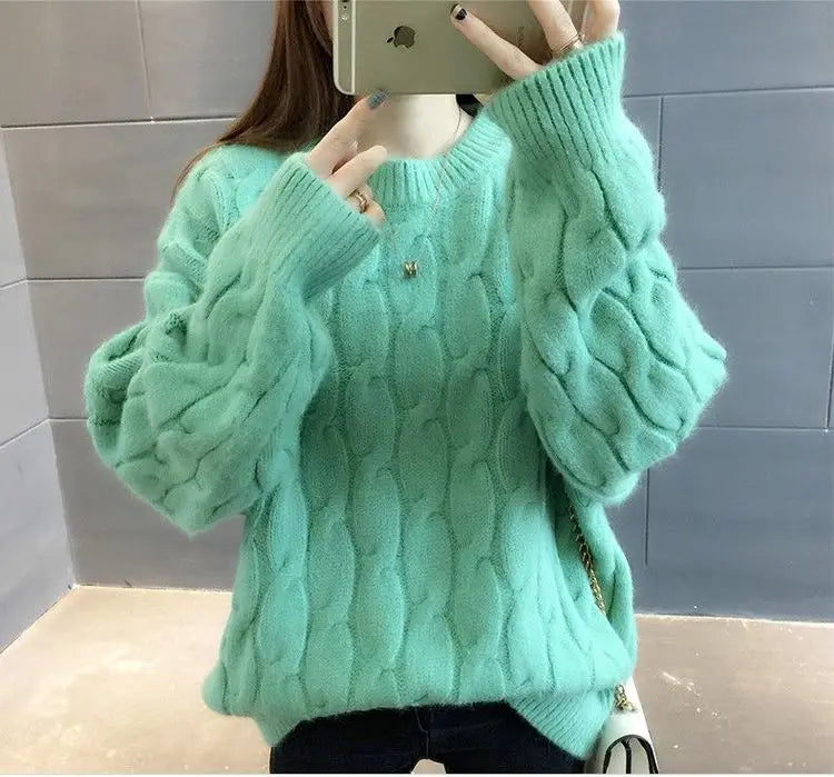 Women's cashmere blend pullover in mint green twisted knit O-neck loose fit sweater - front view arms raised