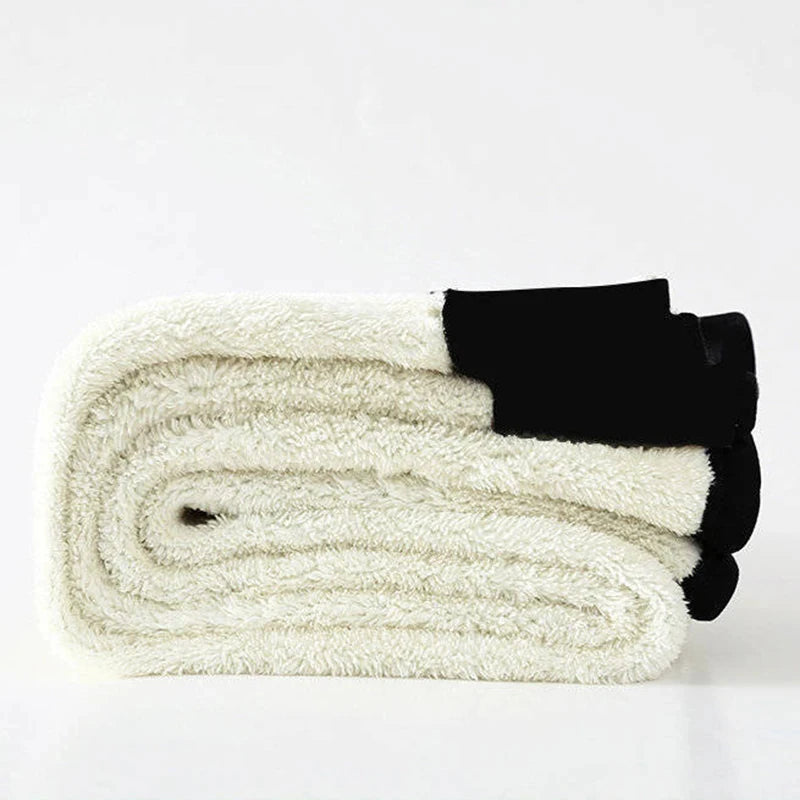 Women's high waist fleece lined thermal leggings in beige and black, folded showing thick soft fleece interior lining