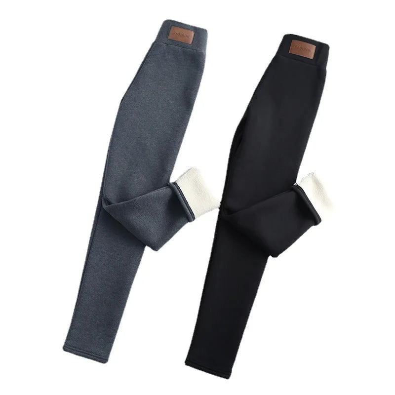 Women's high waist fleece lined thermal leggings in navy blue and black, two pairs shown folded with cream fleece cuff detail visible