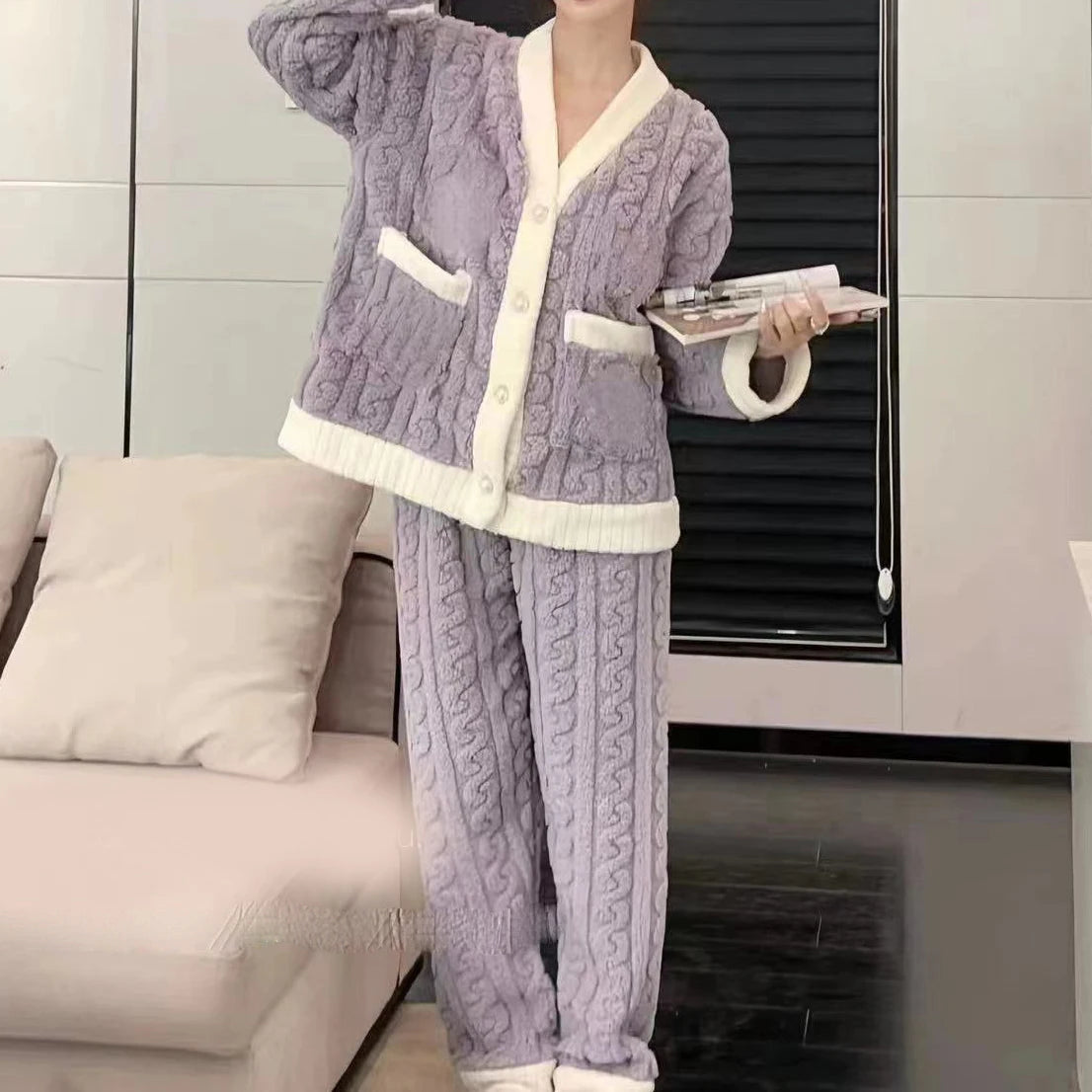 Women's fleece pajama set in lavender purple with white sherpa trim and front pockets - long sleeve jacket top and elastic waist pants, styled on model, front view