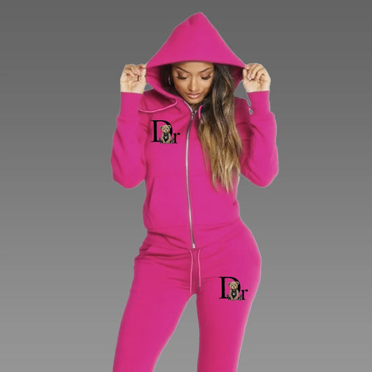 Woman wearing hot pink zip-up hoodie tracksuit set with matching sport pants, front view