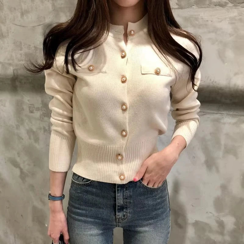 Women's knitted cardigan in cream with gold button closure - long sleeve button-front sweater coat, full body front view