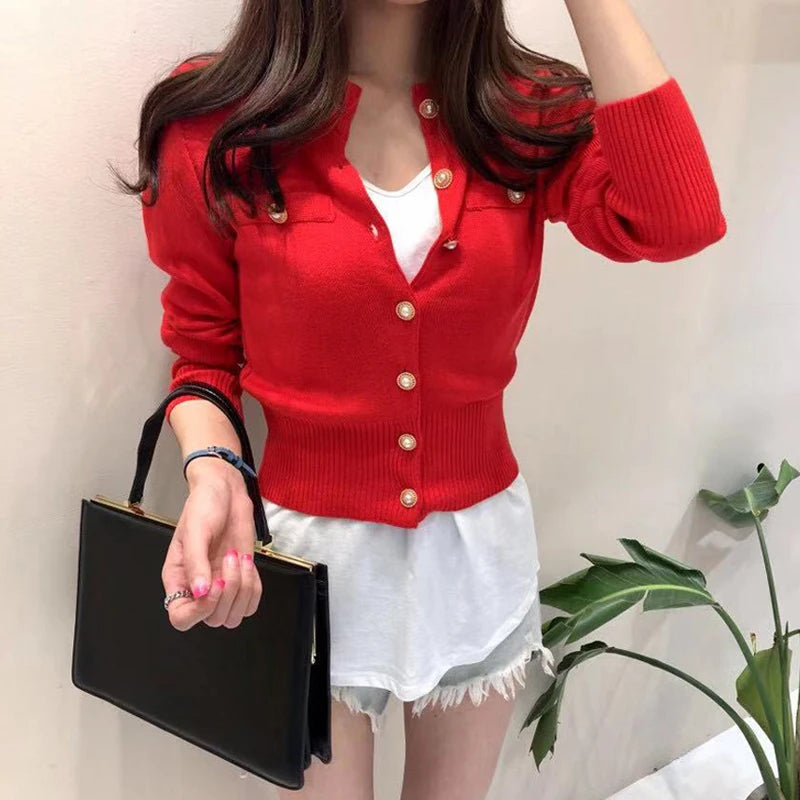 Women's knitted cardigan in red with gold button closure - long sleeve button-front sweater coat, front view styled with white shorts and handbag