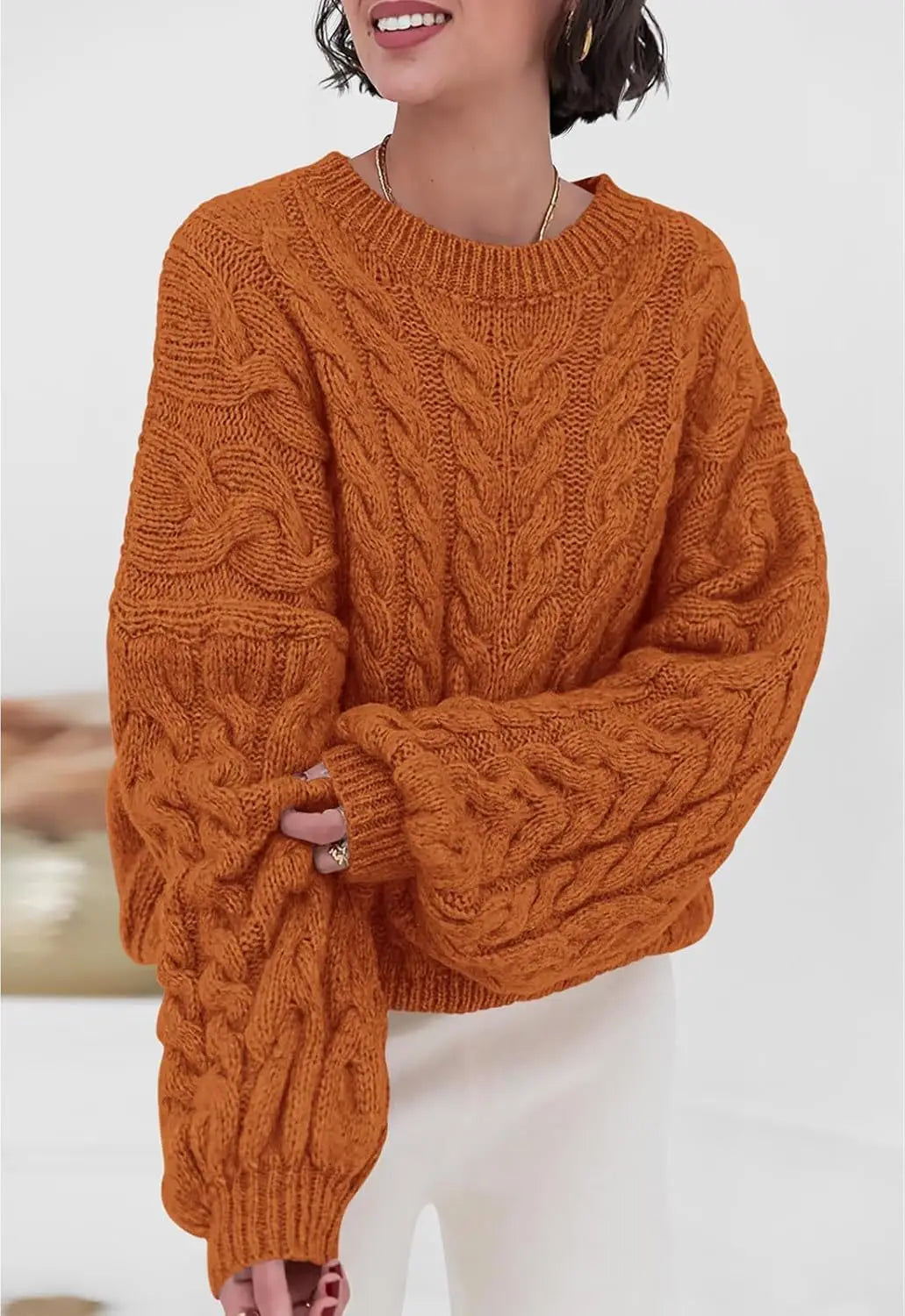 Women's loose fit O-neck sweater in orange cable knit high elastic pullover - front view