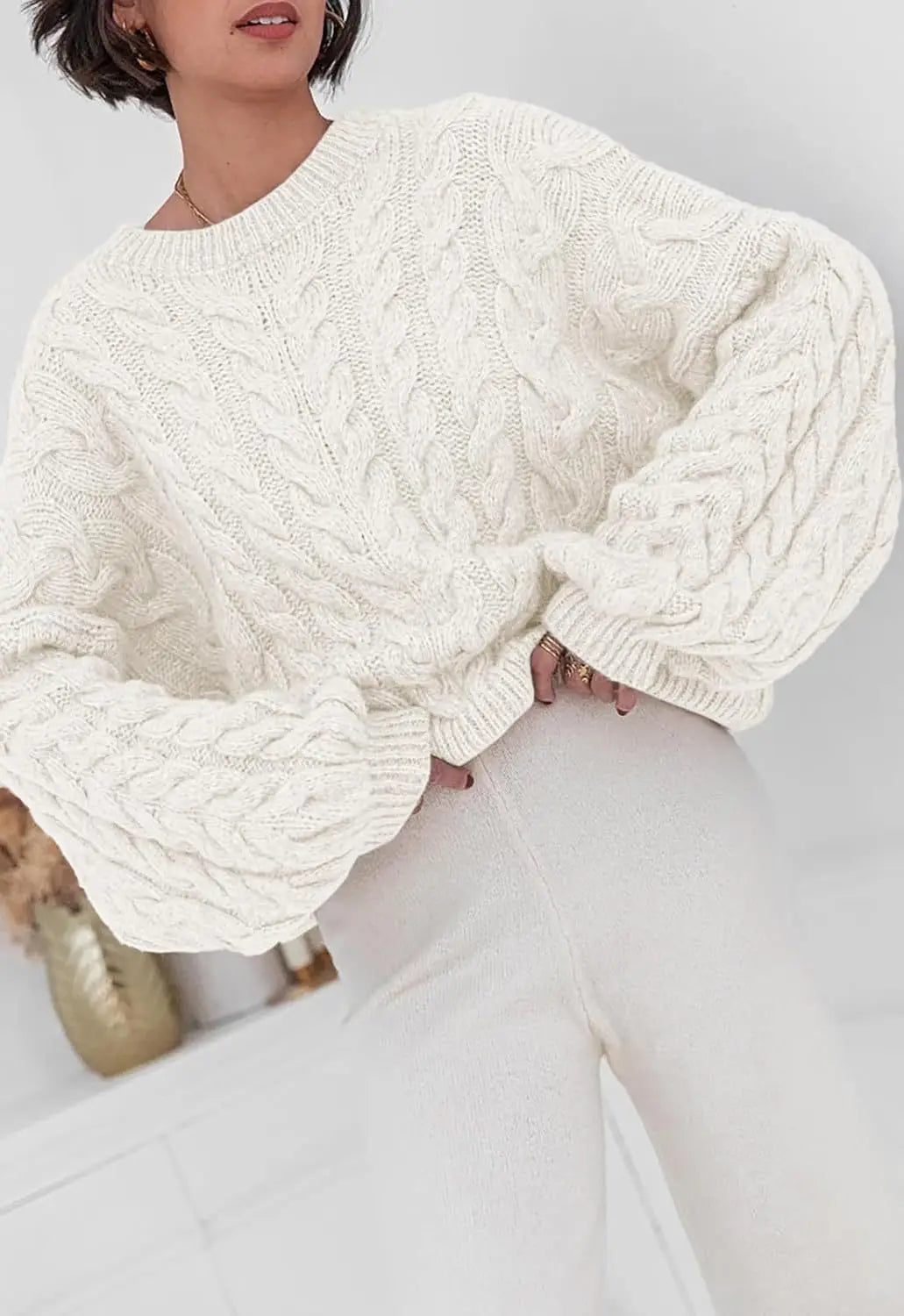 Women's loose fit O-neck sweater in white cable knit high elastic pullover - front view with bag accessory