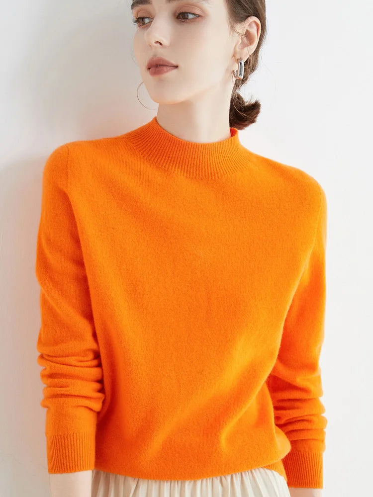 Women's mock neck pullover sweater, soft knit, orange, lifestyle front view