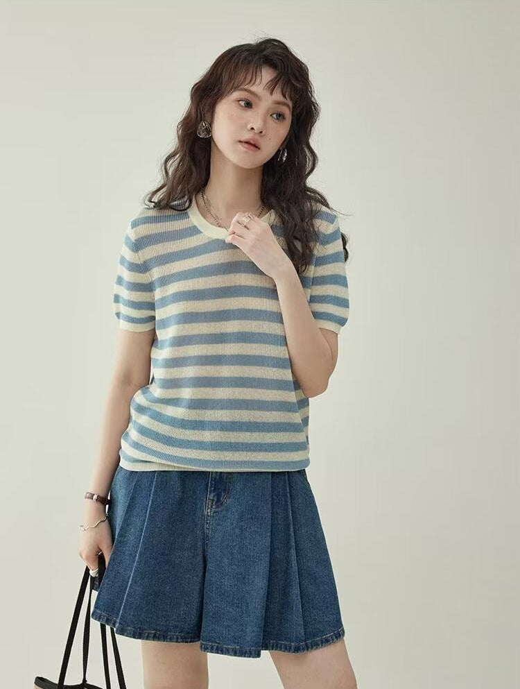 Women's wide leg pleated denim culottes in blue, full body front view styled on model