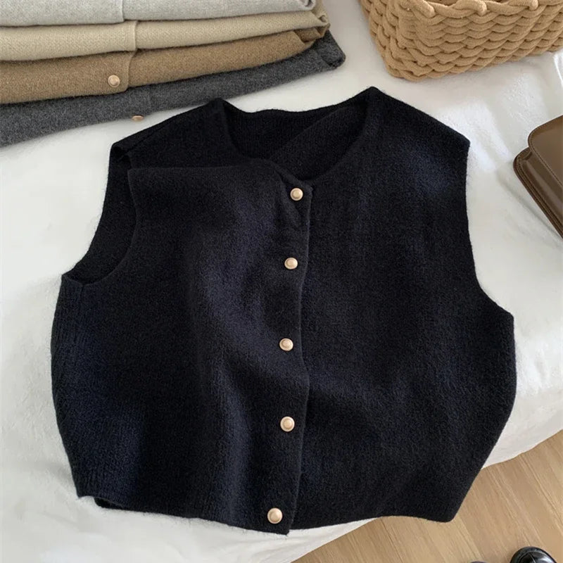 Women's sleeveless knit cardigan with O-neck and button closure, black, front view