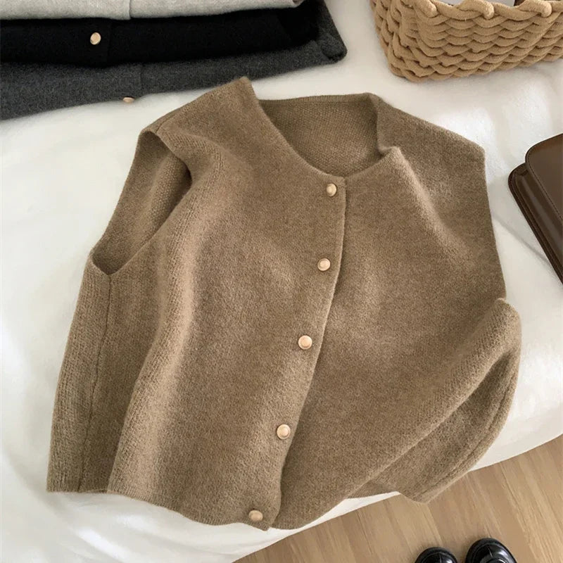 Women's sleeveless knit cardigan with O-neck and button closure, taupe, front view