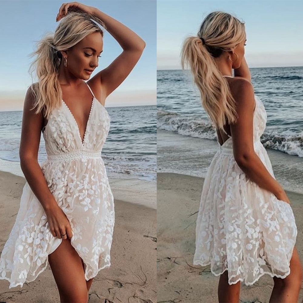 Women's white lace sleeveless deep V-neck backless strap beach dress, front and back view styled on model at beach